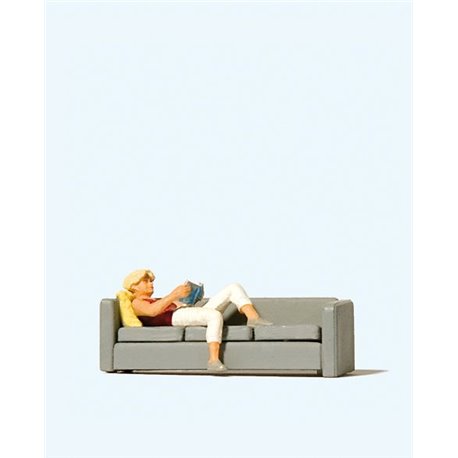 *Woman Reading on Sofa